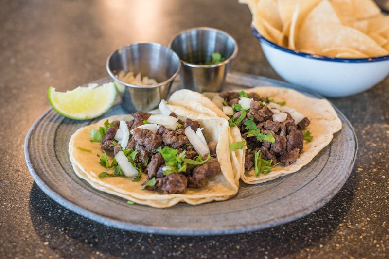 Cafe Rio street tacos with fresh cilantro and onion