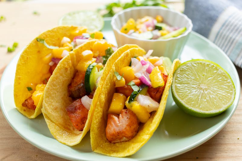 Shrimp tacos with mango salsa and lime